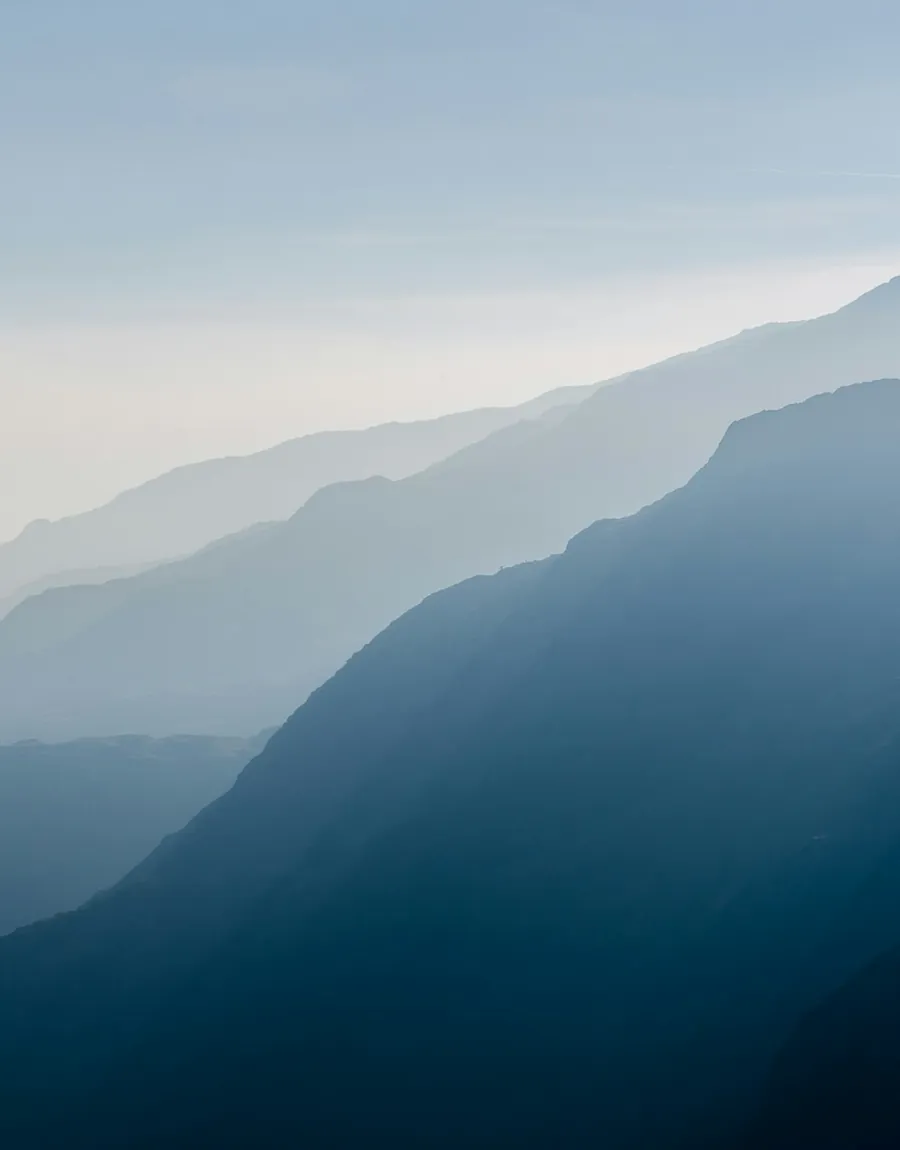 Layered hills above an established estate